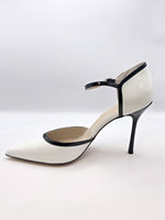 White high-heeled pumps with strap in varnish leather